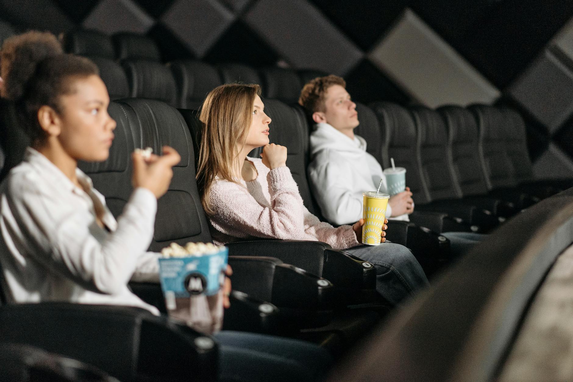 people watching a movie in a cinema
